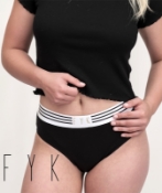 Woman wearing black hemp bikini underwear